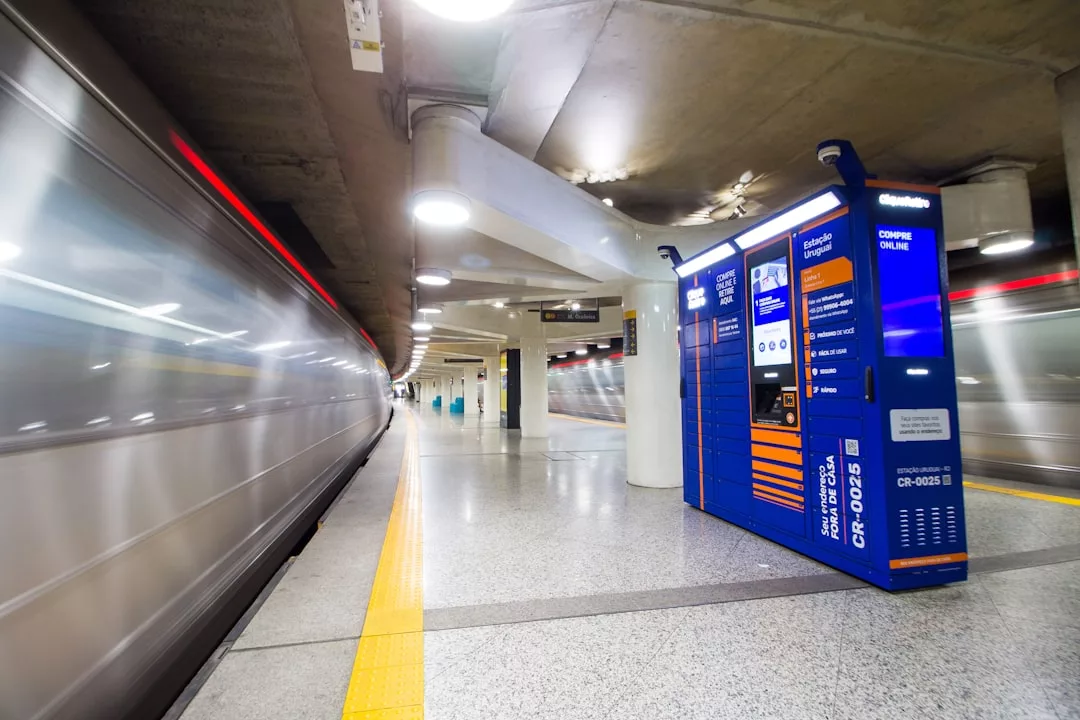 A subway station with a blue parcel locker in the center, ideal for city real estate hubs; a train is leaving the platform, creating a motion blur effect.