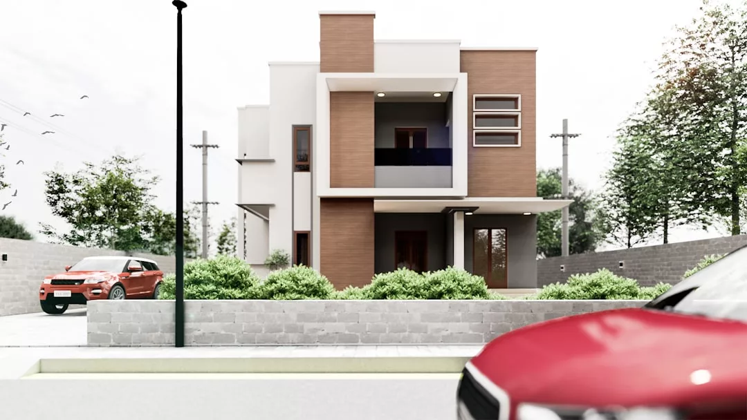 Modern two-story real estate property with a flat roof, large windows, and a mix of white and brown exterior walls. Two red cars are parked outside, and green shrubs line the front yard.